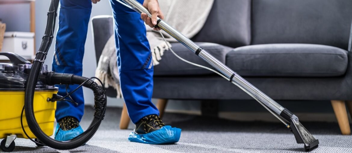 person-cleaning-carpet-with-vacuum-cleaner-picture-id1191080465-1170x508